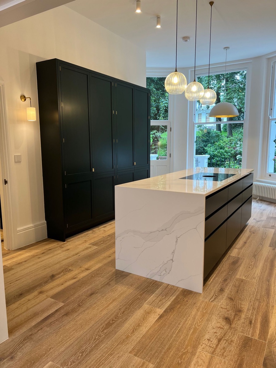 Completed black-and-white kitchen at Marval Construct's Ladbroke Gardens project